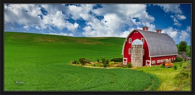red barn and green field